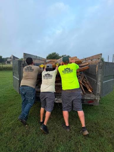 Alamo Bros crew loading trailer